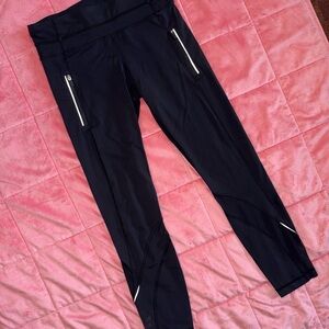 Lululemon Black Leggings with Mesh leg detail and Reflective Accent
